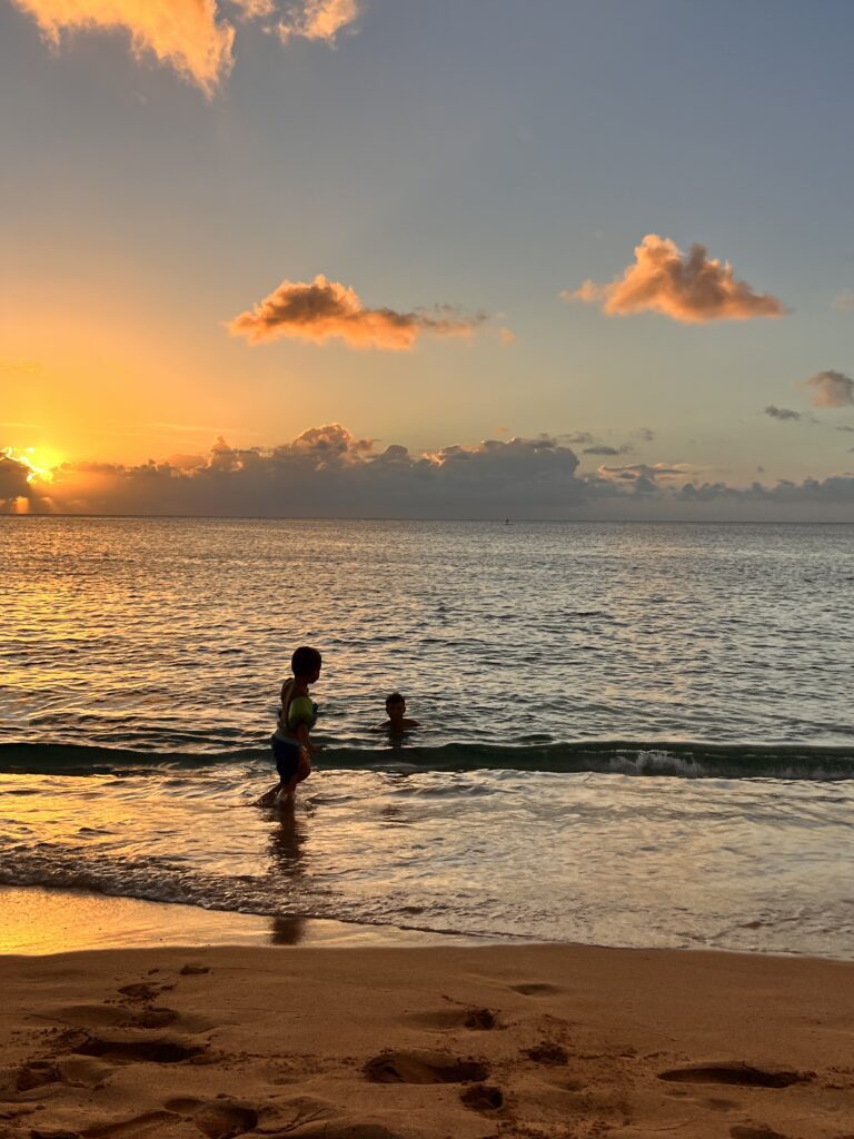 kids playing in beach in hawaii